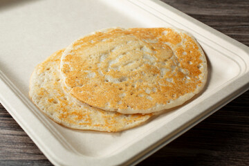 A closeup view of a kal dosa plate.