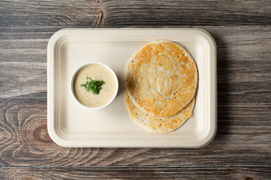 A top down view of a kal dosa plate.