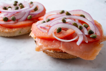 A view of an open faced lox bagel.