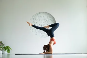 Foto op Plexiglas yoga, Asian woman wearing yoga clothes practicing yoga exercising healthy lifestyle in fitness studio. Sport activity, gymnastics or ballet dancing class. © maya1313
