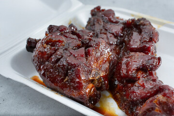 A view of a container of Chinese style BBQ beef ribs.