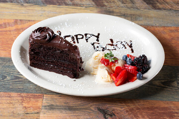 A view of a chocolate birthday cake.