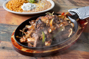 A view of a sizzling order of fajitas.