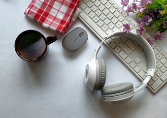 headphones and keyboard on white background