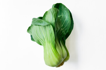 Fresh bok choy on a white background with space for text, perfect for healthy eating concepts and vegetarian recipes - obrazy, fototapety, plakaty