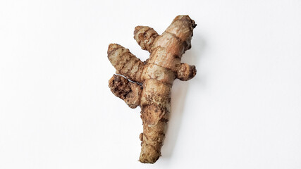 Fresh Curcuma root on a clean white background with ample space for text, ideal for food, health, and wellness-related themes