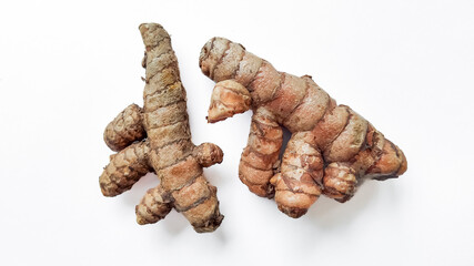 Fresh Curcuma root on a clean white background with ample space for text, perfect for articles on...