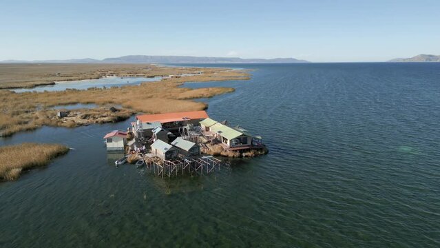 Aerial view of Uros Floating Islands on Lake Titicaca, the highest navigable lake in the world, on the border of Peru, South America.
