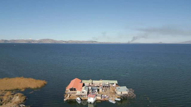 Aerial view of Uros Floating Islands on Lake Titicaca, the highest navigable lake in the world, on the border of Peru and Bolivia, South America.