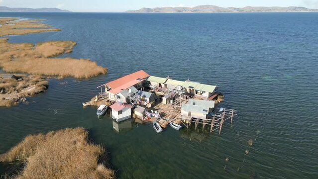 Aerial view of Uros Floating Islands on Lake Titicaca, the highest navigable lake in the world, on the border of Peru, South America.