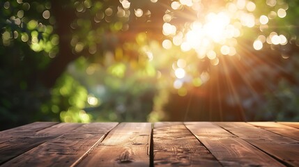 Empty wood table and defocused bokeh and blur background of garden trees with sunlight product...