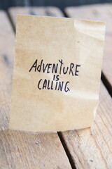 Adventure is calling. The inscription on the tag. Vintage style. Motivational quotes.