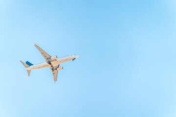 Airplane before landing in blue sky, Boeing 737-800