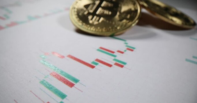 Golden bitcoin models stack on infographic chart in office