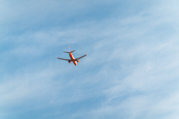 Airplane before landing in blue sky, Boeing 737-82R