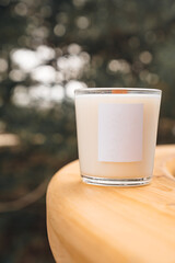 Scented candles on a wooden table. 
