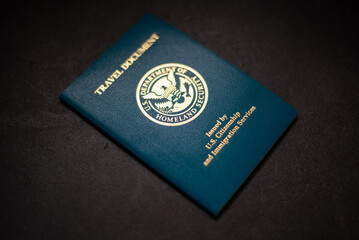 USA Re-entry Permit on black background with shallow focus