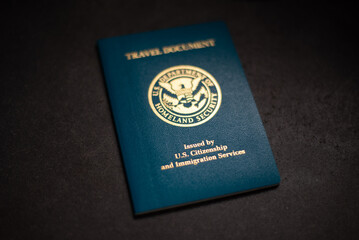 USA Re-entry Permit on black background with shallow focus