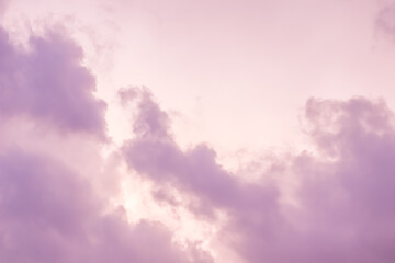 Background of a beautiful pink and pale purple sky with clouds at sunset