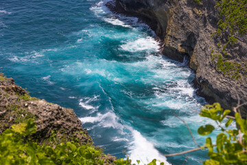 beautiful views of the ocean, waves hitting the rocks, indonesia