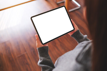 Top view mockup image of a woman holding digital tablet with blank desktop screen