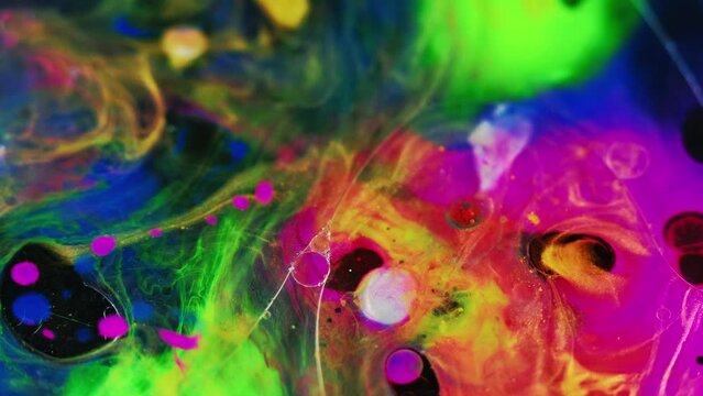 Paint water mix. Oil bubbles. Color vapor. Defocused vibrant pink green blue ink gel fluid sphere floating motion mist texture abstract art background.