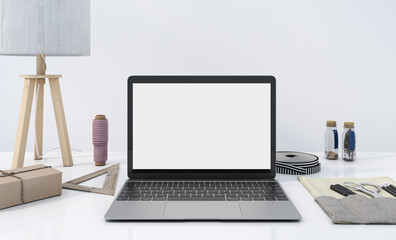 Empty white screen laptop, copy space on the device, working desk decoration with a pot of small plant, mockup office table and white background,  work from home concept, 3d rendering