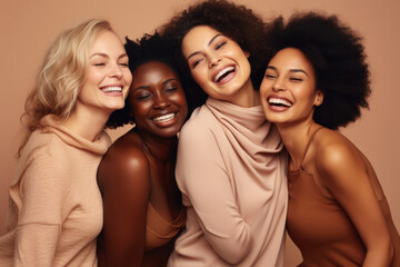 Four women with different hair types and skin tones are smiling
