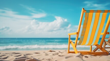 A beach chair is sitting on the sand next to the ocean