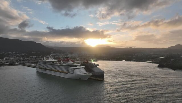 Two Cruise ships at Puerto Plata port at sunset, aerial drone view. FOURTH PART