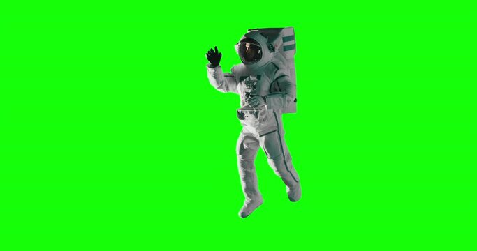 Studio Production Footage on Isolated Mockup Template: Portrait of a Young Male Astronaut Posing in a Space Suit During a Spacewalk Outside in Zero Gravity. Shot on Green Screen Background 