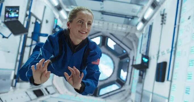 Portrait of a Courageous Female Astronaut on Board a Spacecraft, Floating in Zero Gravity and Looking Around in Wonder. Space Travel, Solar System Exploration and Colonization Concept 