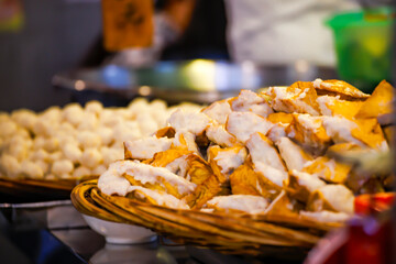 a basket full of plump Ah Gei, one of the most popular street snacks in Taiwan