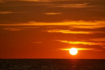 Fototapeten sunset in the sea © PhamVan