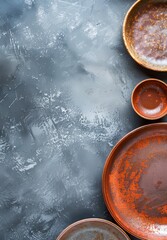 Assortment of Handcrafted Ceramic Dishes on a Neutral Background in Soft Daylight