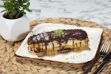 fresh cake, eclair, chocolate eclair, large eclair,