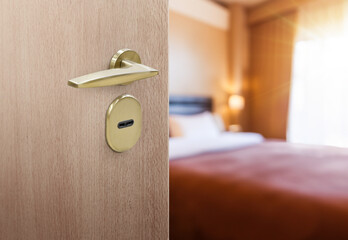 Opened door of hotel room with blurred bedroom background - 762988280