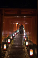 Red torii gate of the shrine at night