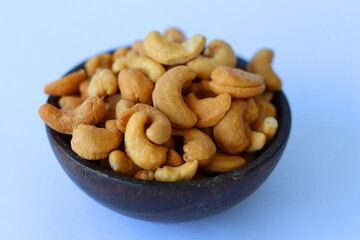 cashews are displayed in traditional and glass containers