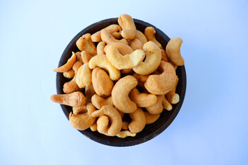 cashews are displayed in traditional and glass containers
