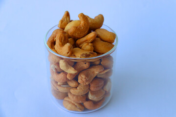 cashews are displayed in traditional and glass containers