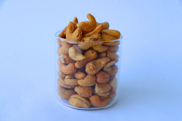 cashews are displayed in traditional and glass containers