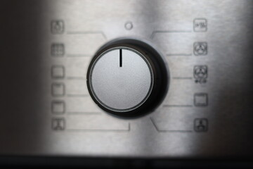 Setting Electric Oven Modes by Turning Switch Control Close Up, Oven program control dial closeup