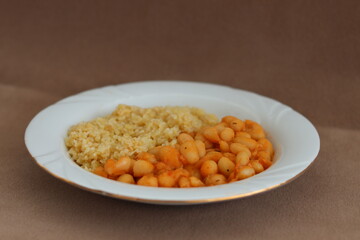 close-up of a traditional Turkish dish of dried beans and bulgur pilaf, black background