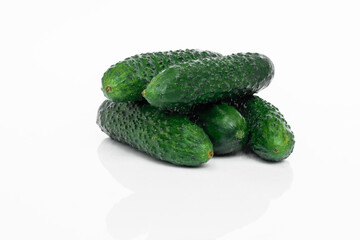 Fresh cucumbers isolated on white background with reflection