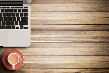 Office desk - Laptop computer and coffee cup on brown old wood texture and background