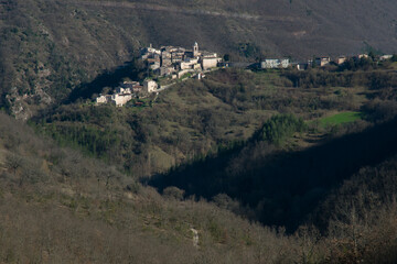 Aerial view of Sellano medieval village in the Umbria mountains, Italy - 762996863