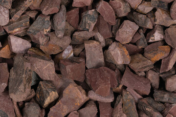 crushed stone crumb background texture close-up. rubble in a heap. natural decorative primer for designers. fraction