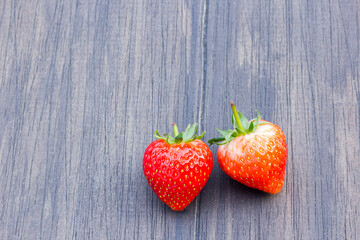 Fresh strawberries on old wooden background