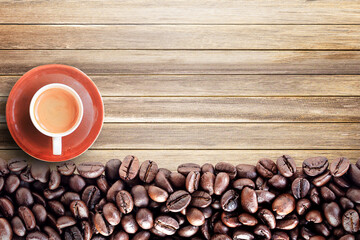 Top view with roasted coffee beans on wood table background area for copy space